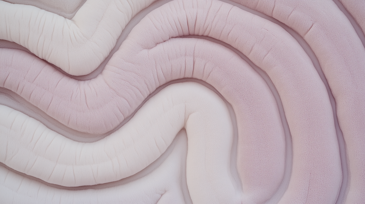 A soft fold of fabric in warm neutral tones
